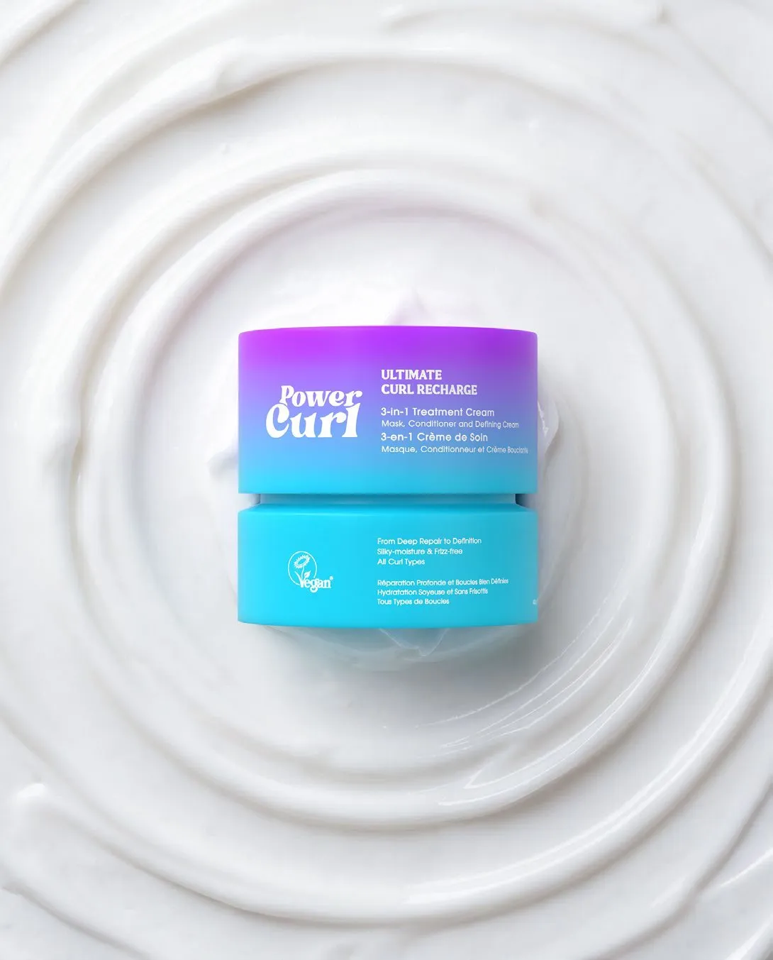 Power Curl Ultimate Curl Recharge jar in a pool of cream